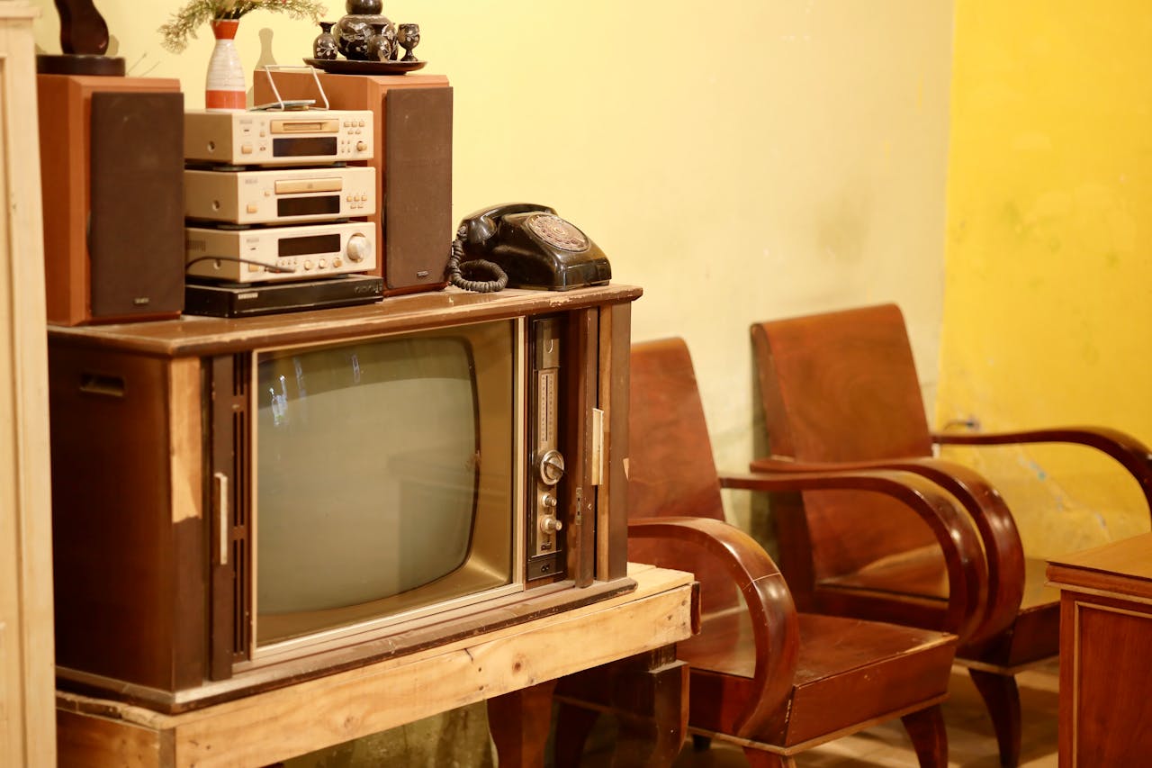 Nostalgic living room scene featuring a vintage TV, turntable, and classic decor.